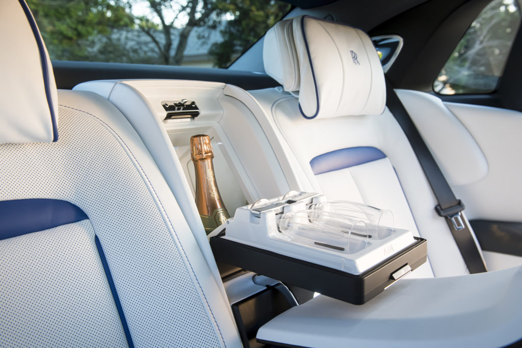 Our favorite option in the 2021 Rolls-Royce Ghost is the chilled compartment outfitted for a bottle of champagne or other adult beverage and glasses. (Photo by James Lipman for Rolls-Royce)