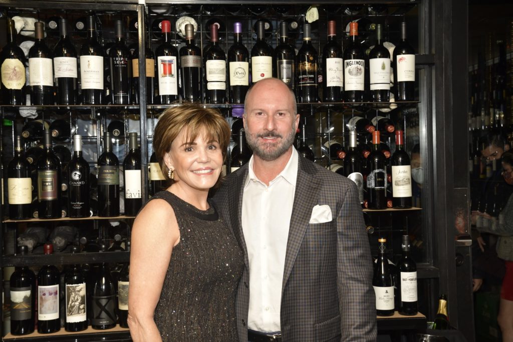 Hallie Vanderhider and honoree Tony Bradfield of Tenenbaum Jewelers dine in the wine cellar at Potente, Astros owner Jim Crane's upscale Italian restaurant. (Photo by Jerry Klumpp)