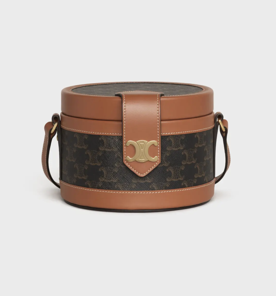 The Tambour bag from Celine is a refined drum-shaped bag constructed of canvas and leather.