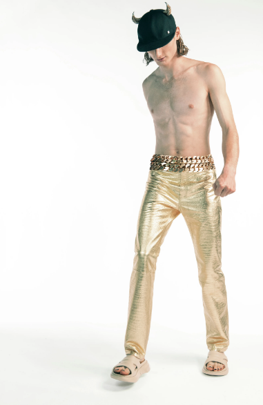 Givenchy gold pants with metallic gold belt and horn hat. (Photo courtesy of Givenchy)