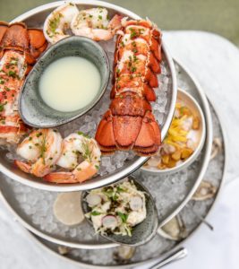 The elevated menu at The Sporting Club includes the Seafood Tower.