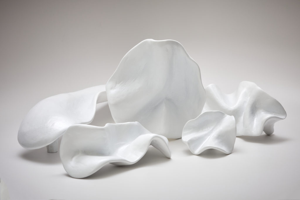 Various shapes of Pinch hardware in matte white.