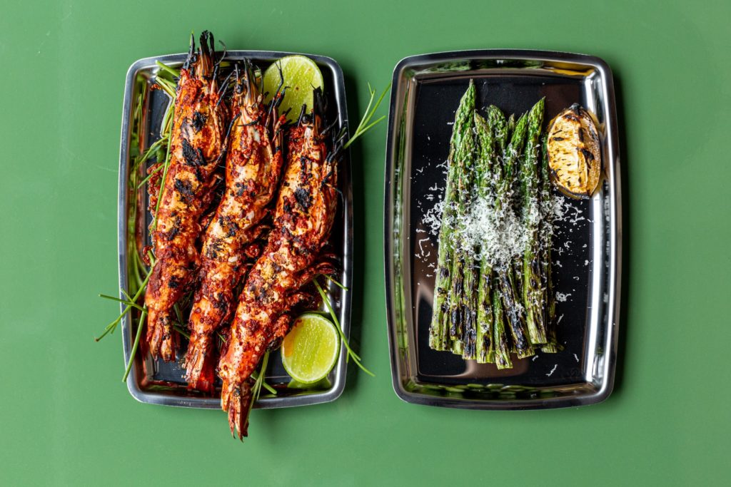 Ostia grilled shrimp with harissa and grilled asparagus