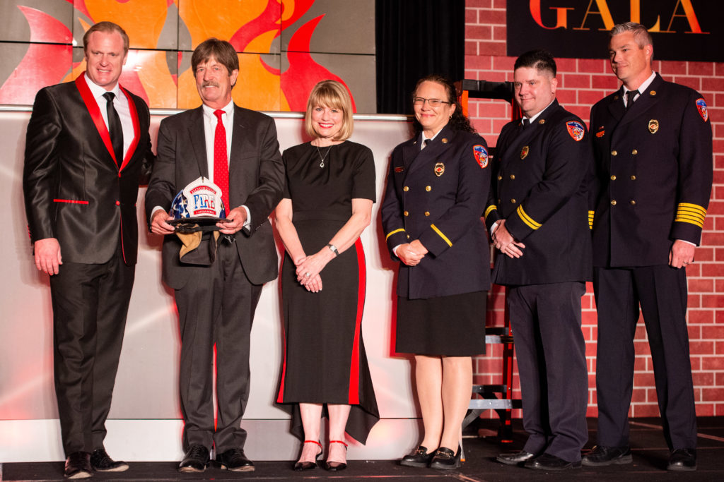 Patrick 'Marty' Lancton, honorary chairs Stephen & Kelley Lubanko with the Houston fire fighter team that brought him back to life after his heart stopped beating for several minutes. (Photo by Michelle Watson CatchlightGroup.com)