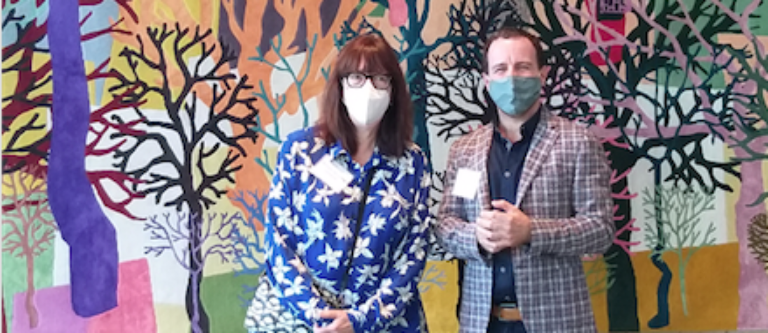 MFAH curator Alison de Lima Greene and Jaime Odabachian of the artist-tapestry firm Odabashian pose in the MFAH future formal restaurant space, Le Jardinier, with Trenton Doyle Hancock’s commission, “Color Flash for Chat and Chew, Paris Texas in Seventy-Two,” 2019-2020. (Photo by CDA)