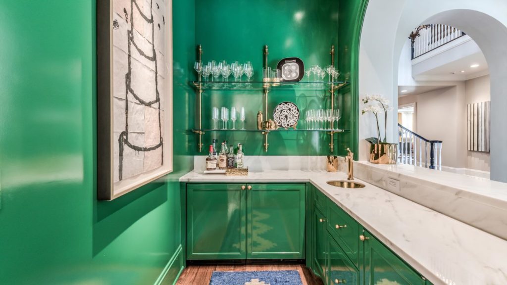 Farnham – the bar makes a statement in shiny green lacquer with open shelving