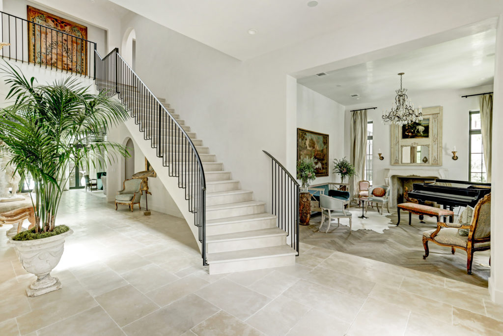 Imported French limestone floors in the French contemporary at 722 Friar Tuck Lane.