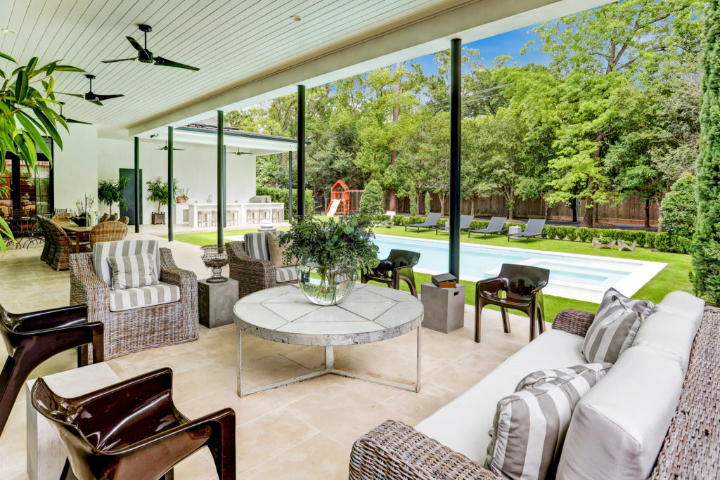 The spacious outdoor summer kitchen/living area at 722 E. Friar Tuck Lane has a home theater.