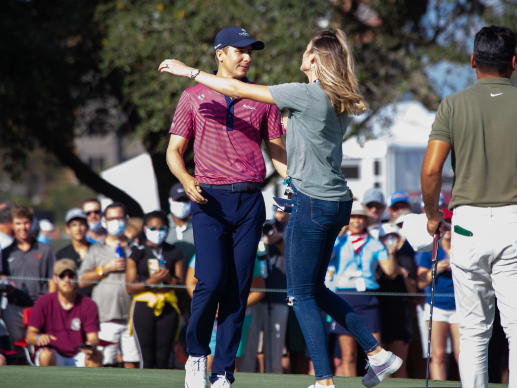 Carlos Ortiz and Haley Ortiz embraced after he shocked the golf world. (Photo by F. Carter Smith)