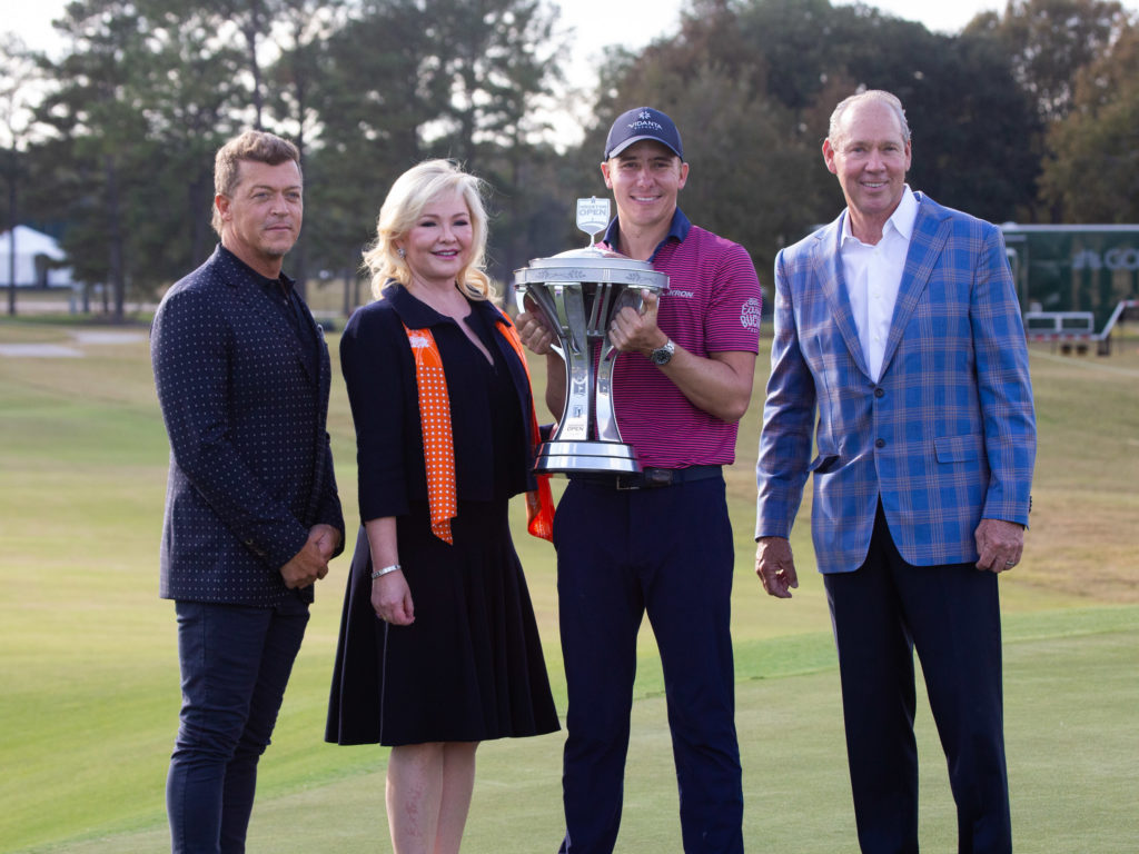 Whitney Crane, Jim Crane, Carlos Ortiz and Vivint CEO Todd Pederson pose after Ortiz's two shot victory. (Photo by F. Carter Smith)
