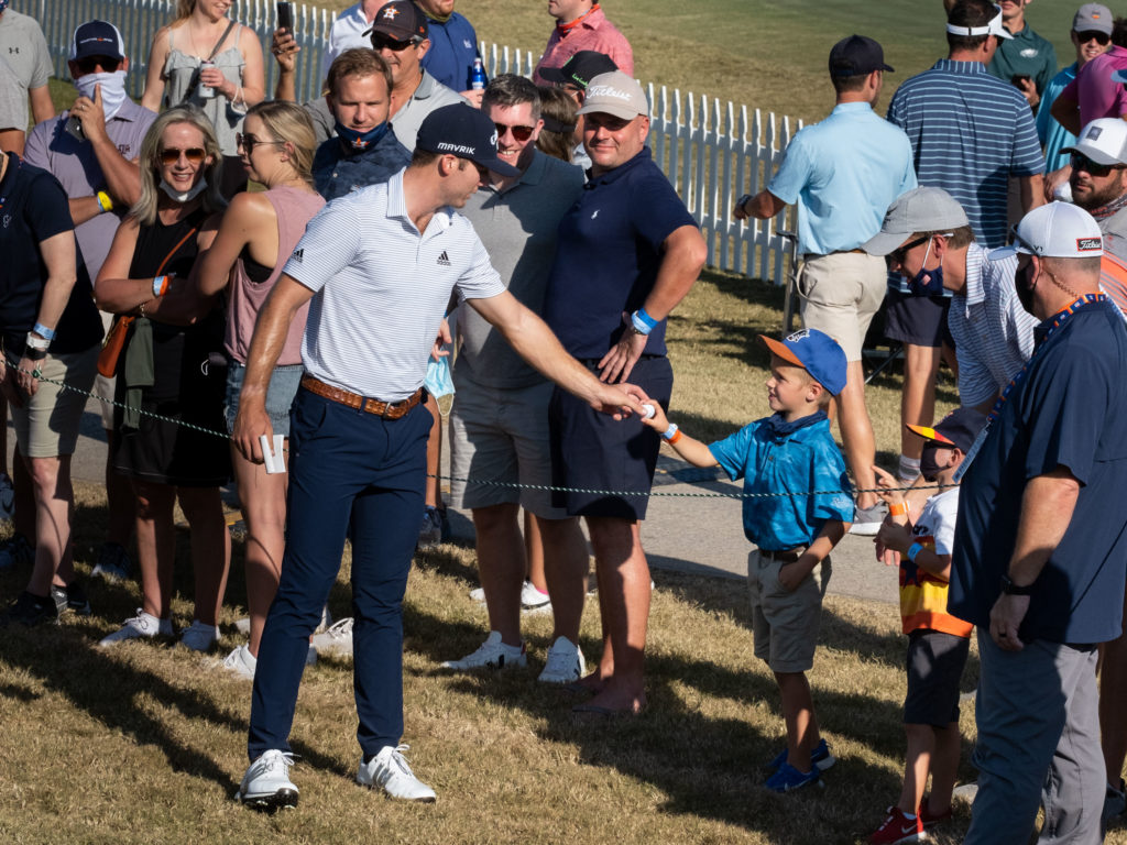 Sam Burns gave his ball to a young fan after finishing up on 18. (Photo by F. Carter Smith)