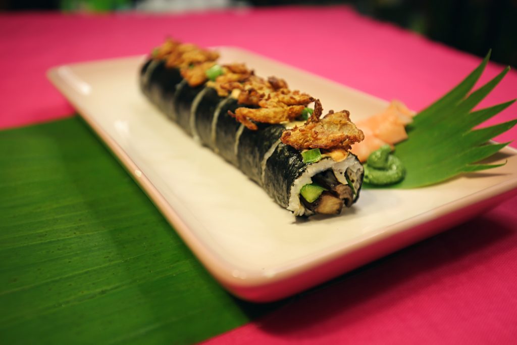 A top seller, The Shroomin’ Around Roll has stir-fried shiitake mushrooms and green onions, topped with sriracha mayo and fried oyster mushrooms.