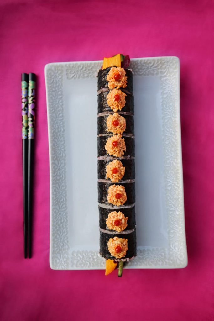 The signature dish at the pop-up was The Super Chef Roll. Compared to a classic California roll, it's filled with a rainbow of vegetables including pickled cabbage, cucumber, avocado, and jalapeños, and topped with spicy crab and a dab of sriracha. 