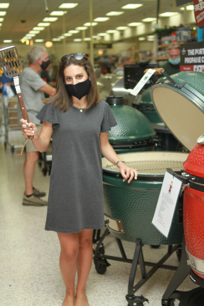 Mary Margaret Pizzitola getting up close and personal with Bering's Big Green Egg grill. (Photo by Chris P. Bachman )