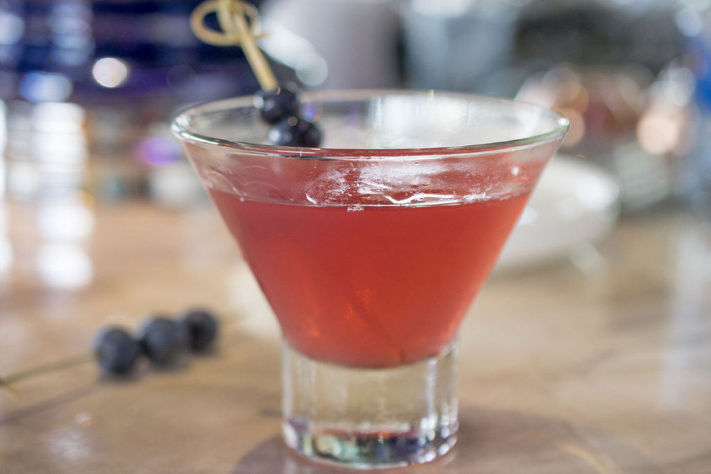 Bluebonnet martini with blueberry vodka and pomegranate syrup at The Rim.