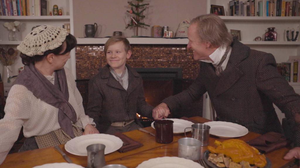 The family that plays the Cratchits together, stays together. Elizabeth Bunch, Mack Hutchison, and Chris Hutchison (Photo by John Carrithers)