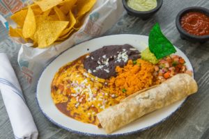 Fronnie’s Superior features a large chicken fajita taco and a cheese enchilada served with your choice of guacamole, pico de gallo, Mexican rice, and your choice of beans.