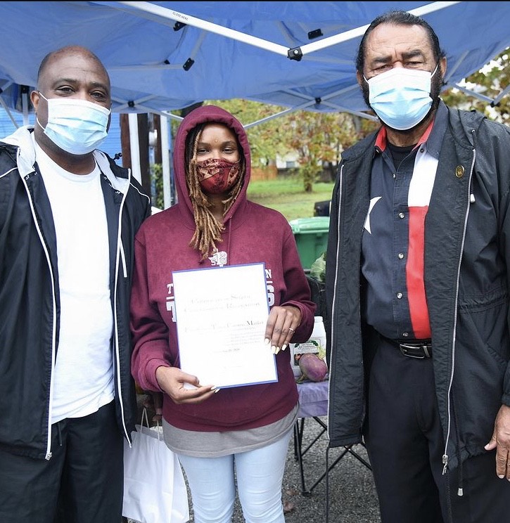 Congressman Al Green presents Sade Perkins with a Certificate of Congressional Recognition for her efforts to make food more accessible to the residents of Houston's oldest Black neighborhood, Freedmen's Town. (Photo by Priscilla T. Graham).