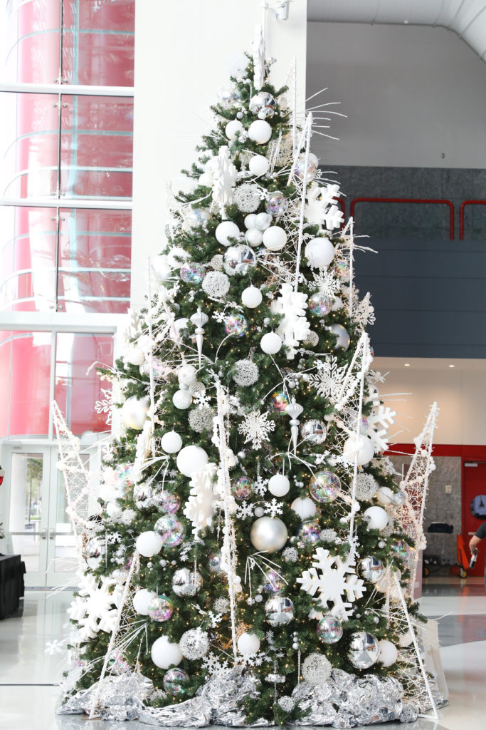 The Alley Theatre Deck the Trees display of decorated conifers. The Signature Tree inspired by Frozen created by Taylor DeMartino and DeMartino Design Group.