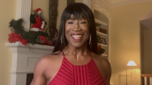 Lauren Anderson presenting Onstage Dinner Holiday Trivia