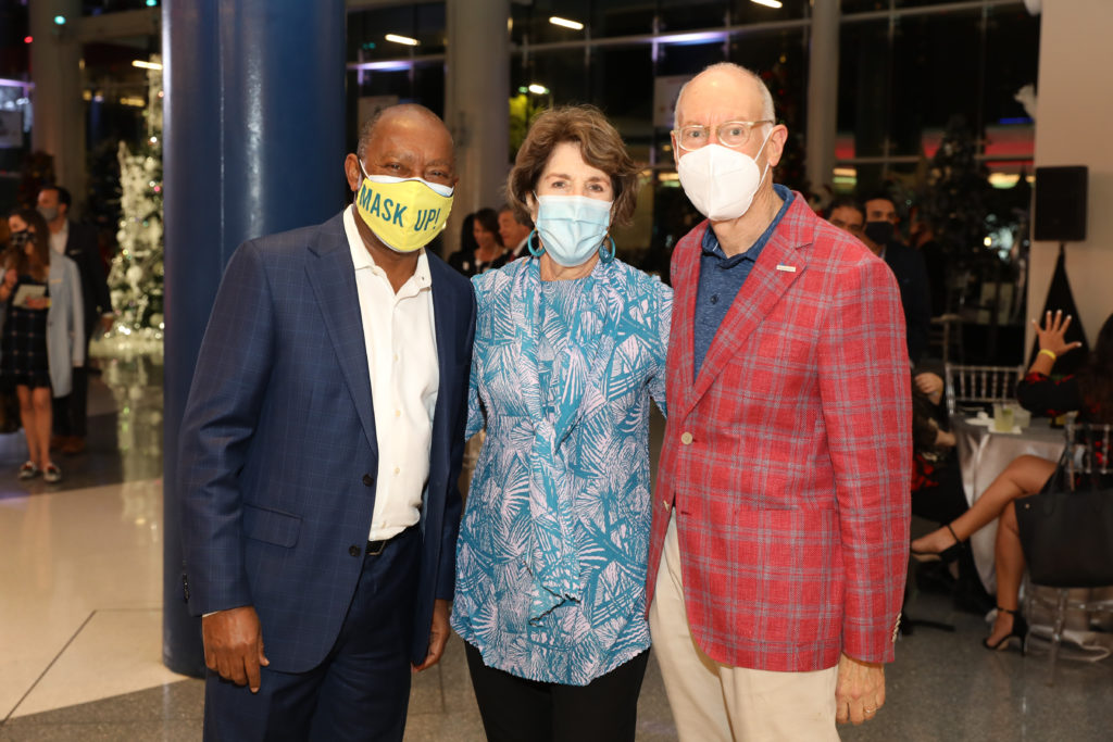 Mayor Sylvester Turner, advocating social distancing and wearing masks, with Lainie Gordon & David Mincberg at the Alley Theatre Deck the Trees event in early December.