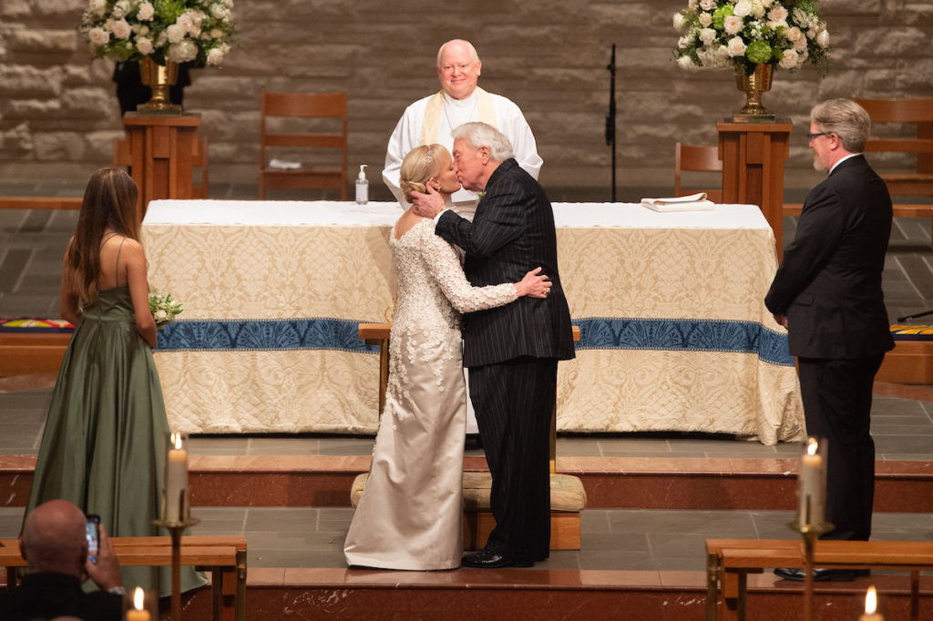 Karen Ann Bradshaw and Jack Rains exchange vows at St. John the Divine Episcopal Church where the Rev. Reagan Cocke officiated. (Photo by Wilson Parish)