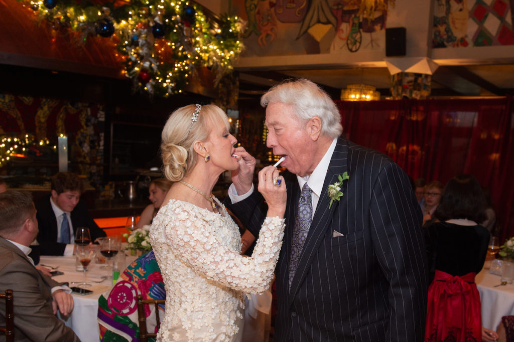Karen Bradshaw Rains & Jack Morris Rains in the traditional sharing of the wedding cake. (Photo by Wilson Parish)