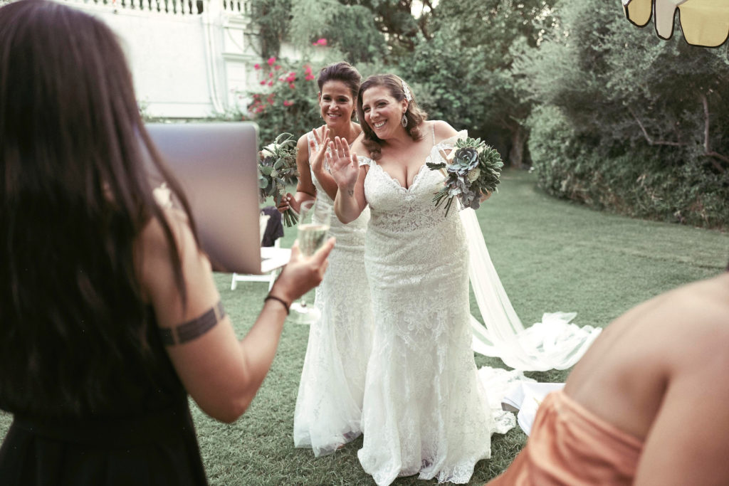 Greeting the select few invited to the private ceremony via Zoom. (Photo by Tom Shirmacher)