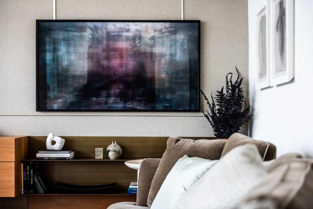 Abstract stone sculpture by Mirjam De Nijs sits atop books on the Porro wall unit. Jason Shulman's "The Shining" (1980), 2016 from Cob Gallery, London. (Photo by Robert Yu)