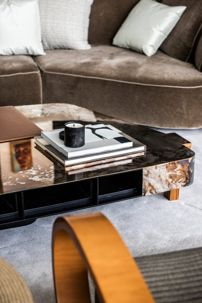 Tiny handprints from a friend's toddler make for beautiful memories on the table's patinated silver finish. Custom mohair sofa by Vioski. (Photo by Robert Yu)