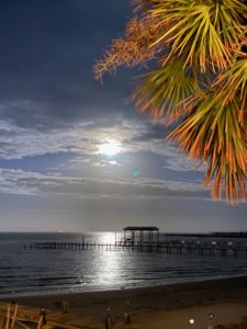 A full moon sky as seen from Pier 6 Seafood & Oyster House in San Leon, Texas.