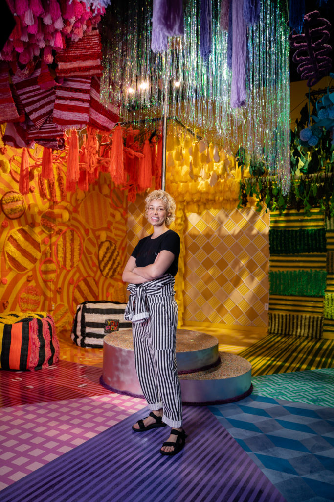 Molly Sydnor welcomes you to a jungle that's filled with woven tapestries and memories, "Temporal Jungle." (Photo by Timothy Alsbrooks)