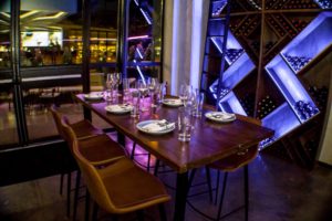 Stirr Fort Worth inside near the wine wall.