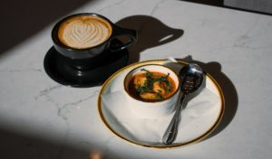 White Rhino winter spiced latte and a cup of tomato basil soup.