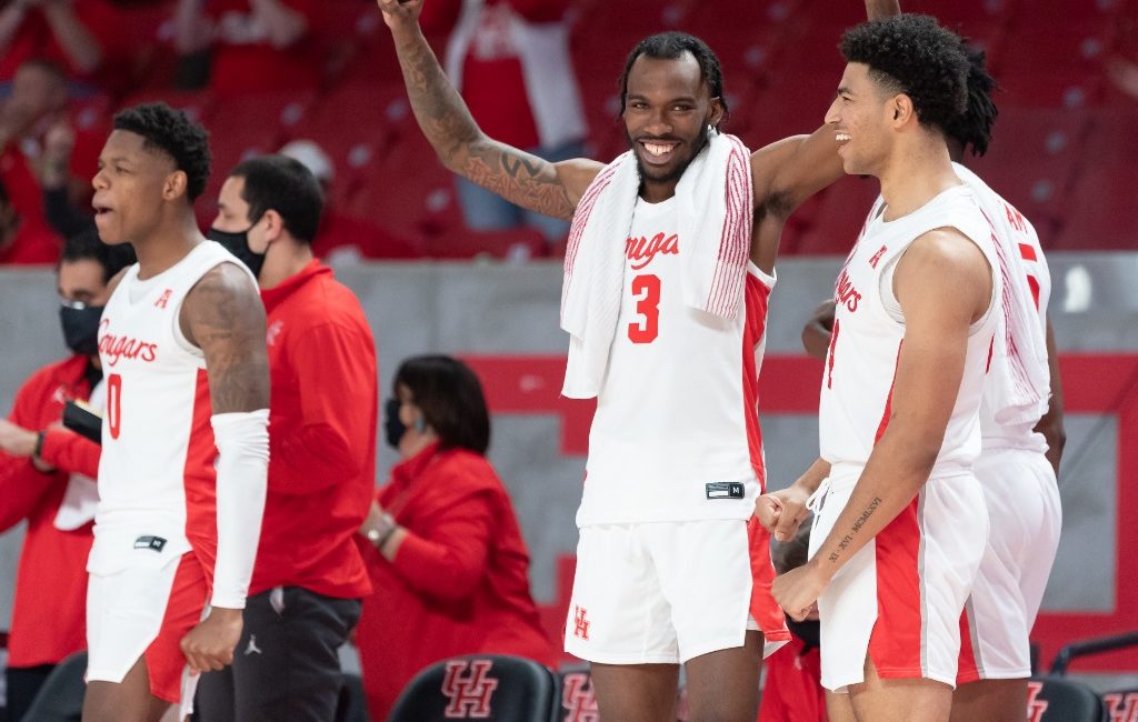 Marcus Sasser, DeJon Jarreau and Quentin Grimes relax and enjoy their teammates play late in the blowout of Tulane.