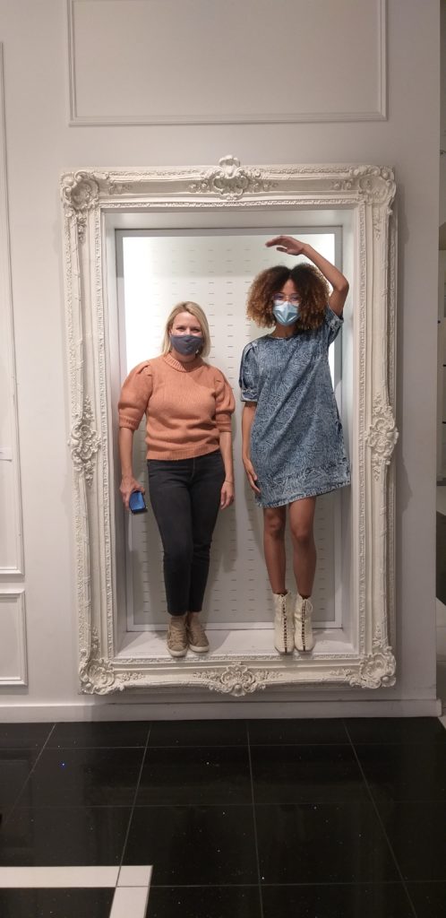 Piper Faust, public art curator, stops by to chat with India Lovejoy and see the show. (Photo by Catherine D. Anspon)