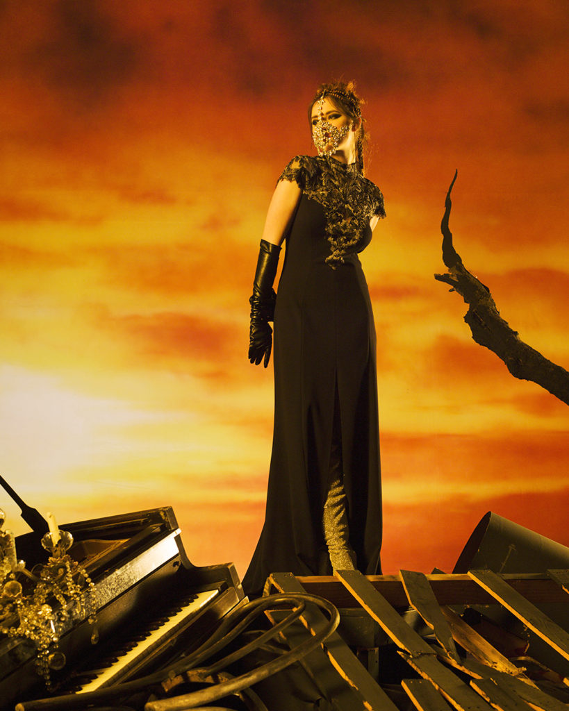 Tadashi Shoji black/steel textured crepe cap sleeve gown with embroidered applique detail. (Photo courtesy of Tadashi Shoji)