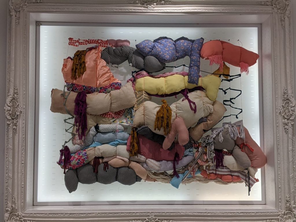 Miñarros' work had a room to itself with sculpture made of reclaimed clothing that mimicked hanging meat. Bárbara Miñarro's "Between Us," 2018