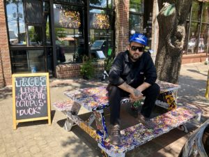 Regino Rojas in front of his Deep Ellum Revolver Taco Lounge