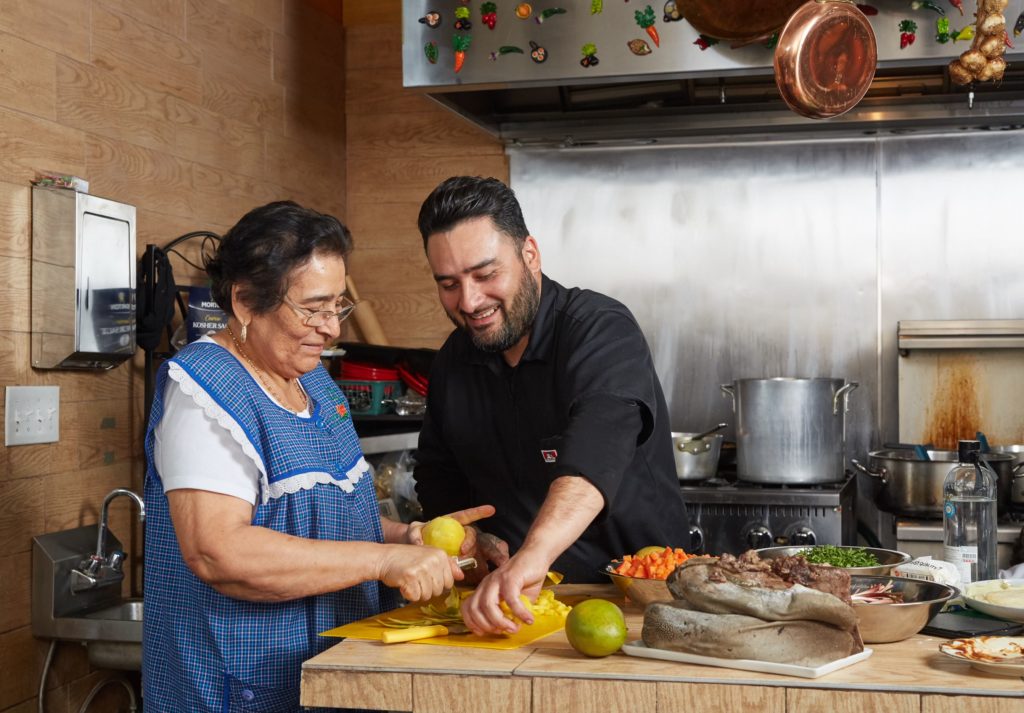 Chef Regino Rojas with his inspiration — his mother Juanita — is opening a new Revolver Taco in Fort Worth.