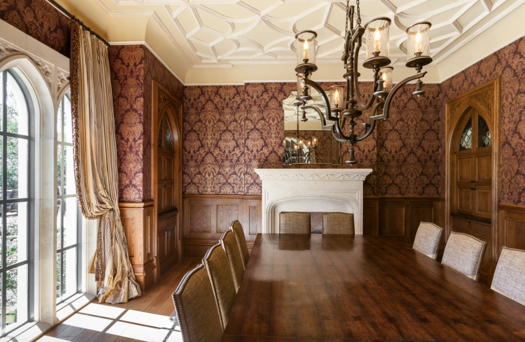 The dining room in the mansion at 3996 Inverness with the carved fireplace echoes the design of an English Country House. (Photo by Julie Soefer)