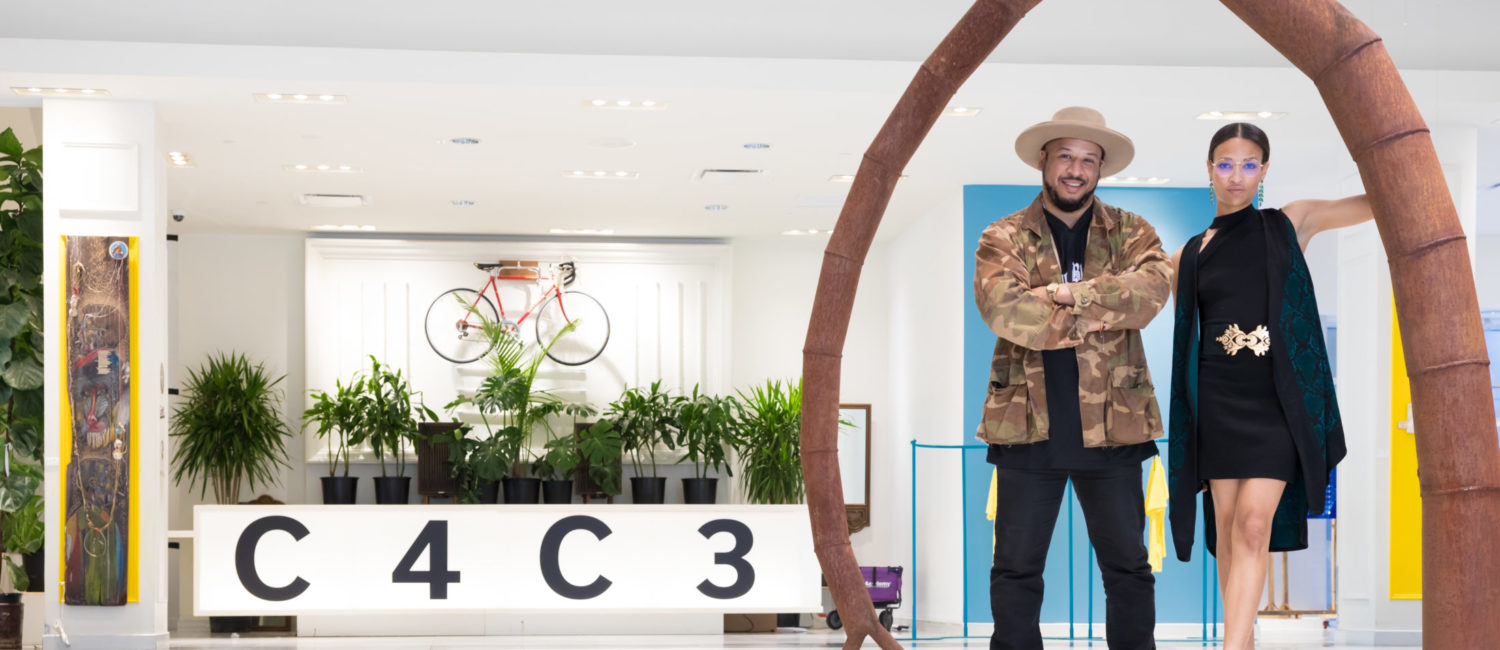 Dynamic duo, Robert Hodge and India Lovejoy have the recipe down on how to throw a successful art show. The pair poses under Tim Glover’s “Listening to Nature,” 1995. (Photo by Emile C. Browne)