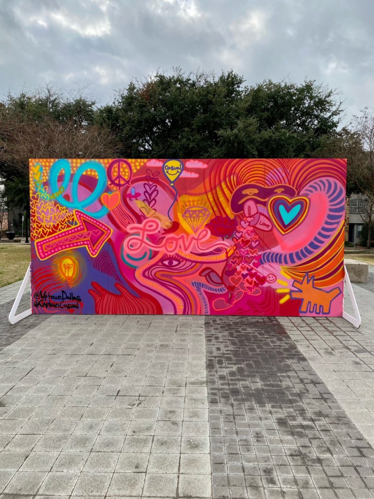 The February mural promotes Love & Kindness and the community is asked to interact with the wall by writing in what/who they love and want to spread kindness to.