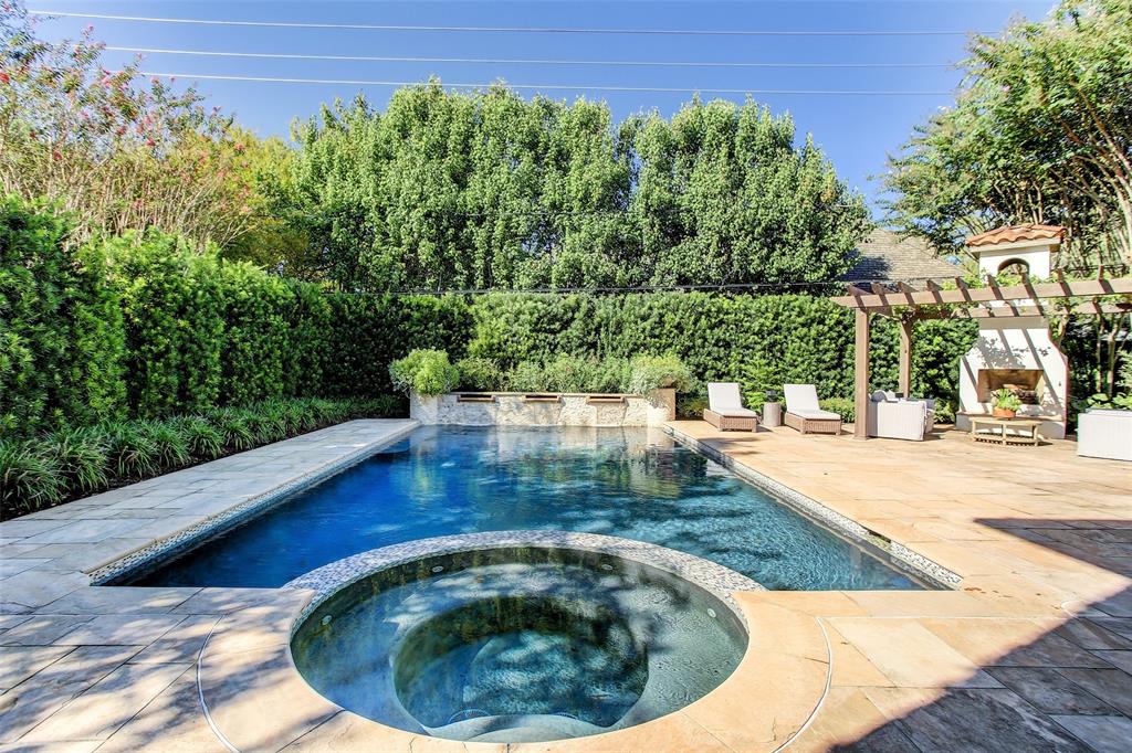 The 5300 Bayou Glen residence boasts a refinished pool and spa, an all-new summer kitchen and a fireplace.