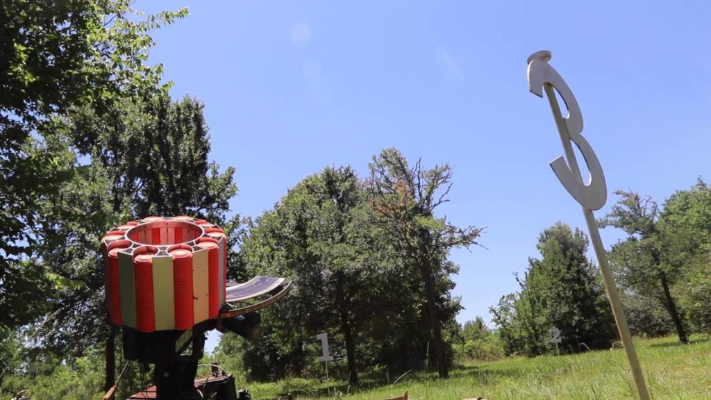 A Greater Houston Sports Club target launcher waits for shooters to shout, "Pull!" and send shooting clays into the air.