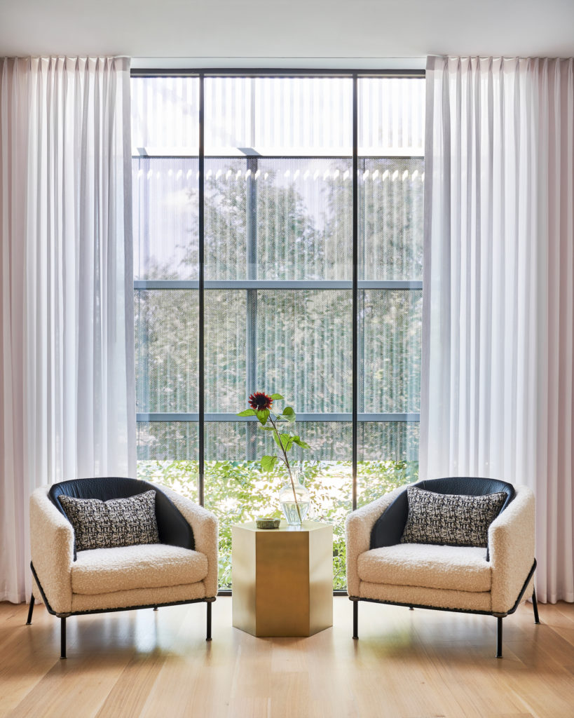 In the upstairs sitting area, Minotti chairs and Noir table. (Photo by Stephen Karlisch)