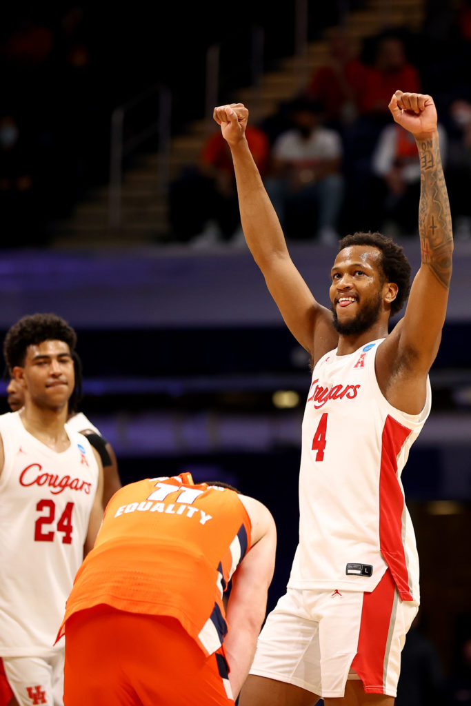 Justin Gorham raised his arms in victory after bringing it for Houston all night. (Photo by Jamie Schwaberow/NCAA Photos via Getty Images)