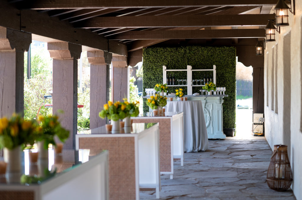 The back loggia at Hermann Park Conservancy's Lott hall is set with bar and cocktail tables. (Photo by Sarah Austin of Chris Bailey Photography)