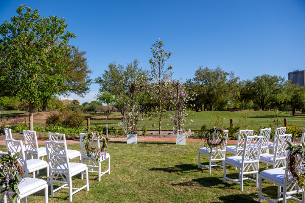 The lawn is staged as a wedding set up with the Hermann Park golf course as backdrop to the Lott Hall ceremony. (Photo by Sarah Austin of Chris Bailey Photography)