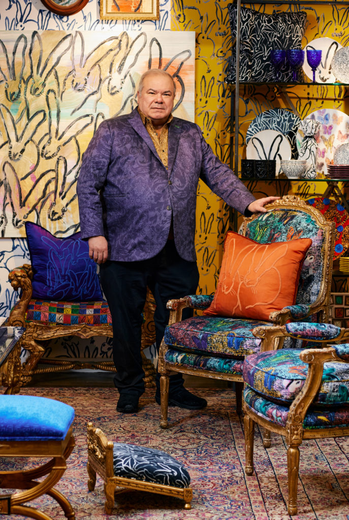 The cult-favorite neo-expressionist Hunt Slonem poses in his Hop Up Shop pop-up located on the seventh floor of Bergdorf Goodman. 